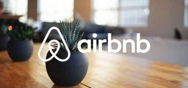 airbnb logo overlaid on image of dining table | features of airbnb | HiRUM