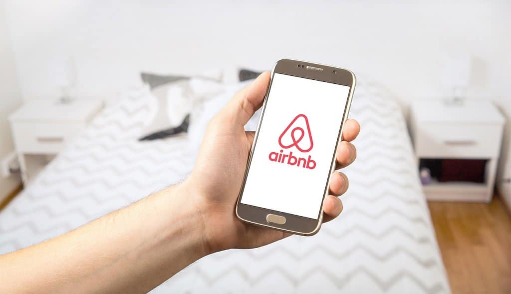 airbnb on a mobile phone | best channel manager for airbnb | HiRUM