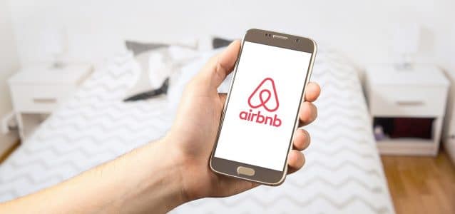 airbnb on a mobile phone | best channel manager for airbnb | HiRUM