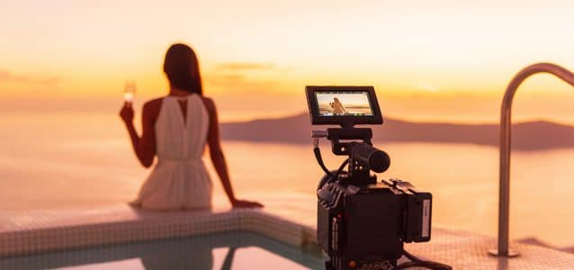 photography equipment set up to capture a woman at sunset